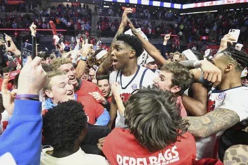 Mississippi forward Malik Dia (0), center, celebrates a win over Tennessee following an NCAA college basketball game in Oxford, Miss., Wednesday, March 5, 2025. (AP Photo/Bruce Newman)