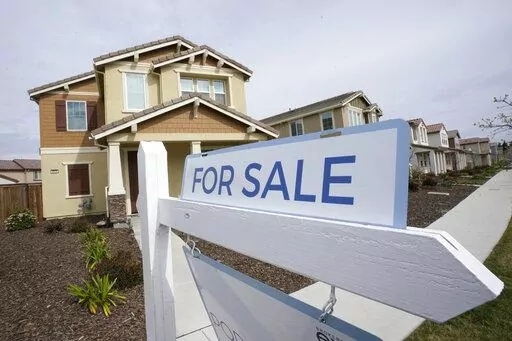 A for sale sign is posted in front of a home in Sacramento, Calif., Thursday, March 3, 2022. The Federal reserve is expected at its meeting this week to raise its key interest rate by a substantial three-quarters of a point for the third consecutive time. Another hike that large would lift its benchmark rate — which affects many consumer and business loans — to a range of 3% to 3.25%, the highest level in 14 years.(AP Photo/Rich Pedroncelli, File)