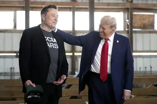 Tesla and SpaceX CEO Elon Musk, left, and Republican presidential nominee former President Donald Trump attend a campaign event at the Butler Farm Show, Oct. 5, 2024, in Butler, Pa. (AP Photo/Alex Brandon, File)