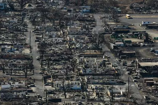 A general view shows the aftermath of a wildfire in Lahaina, Hawaii, Thursday, Aug. 17, 2023. In the aftermath of the deadly Maui wildfires, some social media users are discouraging residents from accepting disaster aid by falsely claiming the Federal Emergency Management Agency could seize their property if they do. (AP Photo/Jae C. Hong, File)
