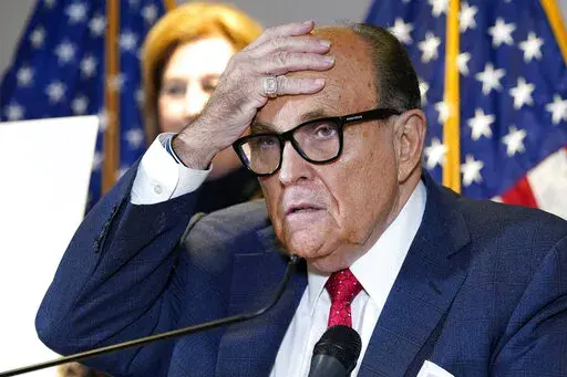In this Nov. 19, 2020, file photo, former New York Mayor Rudy Giuliani, who was a lawyer for President Donald Trump, speaks during a news conference at the Republican National Committee headquarters in Washington.  The House committee investigating the Capitol insurrection has issued subpoenas to some of Donald Trump's closest advisers, including Rudy Giuliani  Sidney Powell stands behind. (AP Photo/Jacquelyn Martin, File)