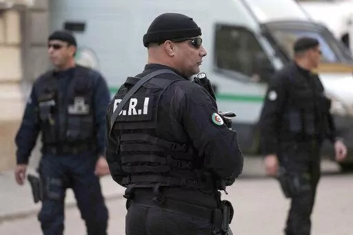 Officers of the Algerian Rapid Intervention Force (BRI) patrol outside the palace of justice on Dec. 2, 2019. A team from Algeria's Rapid Intervention Force on March 24, 2022 put Mohamed Benhalima, 32, in their vehicle, strapping him with a protective vest before the ride to his still unknown destination, video on social media shows. hree days later, Algerians could watch the televised confession of Benhalima, who went from faithful servant of his homeland as a non-commissioned officer to suppor