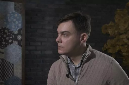 In this image from video provided by the Dossier Center, a London-based investigative group funded by Russian opposition figure Mikhail Khodorkovsky, Gleb Karakulov speaks during an interview in Turkey in December 2022. Karakulov, who was responsible for setting up secure communications for Russian President Vladimir Putin, said moral opposition to Russia’s invasion of Ukraine and his fear of dying there drove him to speak out, despite the risks to himself and his family. He said he hoped to i
