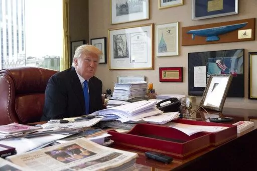 Then-Republican presidential candidate Donald Trump is photographed during an interview with The Associated Press in his office at Trump Tower in New York, May 10, 2016. The legal investigation into former President Donald Trump's handling of sensitive information is the culmination of a lifelong habit of collecting memorabilia, disregard of rules governing recordkeeping and a chaotic transition of his own making after refuse to accept defeat in 2020. (AP Photo/Mary Altaffer, File)