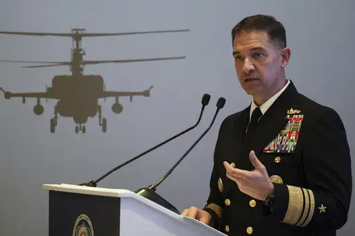 U.S. Navy Vice Adm. Brad Cooper, who heads the Navy's Bahrain-based 5th Fleet, speaks at an event at the International Defense Exhibition and Conference in Abu Dhabi, United Arab Emirates, Feb. 21, 2023. Iran is "very directly involved" in attacks by Yemen's Houthi rebels on shipping over Israel's war on Hamas in the Gaza Strip, Cooper told The Associated Press on Monday, Jan. 22, 2024. (AP Photo/Jon Gambrell, File)