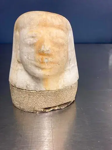 This photo provided by  U.S. Customs and Border Protection shows an ancient Egyptian artifact. Federal agents in Memphis have seized the potentially 3,000-year-old ancient Egyptian artifact that was shipped in from Europe.  U.S. Customs and Border Protection says they intercepted the Egyptian canopic jar lid of the funeral deity named Imsety on Aug. 17, 2022.  The jars were used to hold the internal organs of mummies.  ( U.S. Customs and Border Protection via AP)