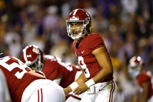 Alabama quarterback Bryce Young (9) calls a play during the first half of an NCAA college football game against LSU in Baton Rouge, La., Saturday, Nov. 5, 2022. (AP Photo/Tyler Kaufman)