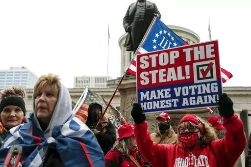 Supporters of President Donald Trump demonstrate during a rally on, Jan. 6, 2021, at the Ohio Statehouse in Columbus, Ohio. This week’s gripping testimony about threats to election officials by former President Donald Trump and his followers had a rapt audience outside Washington -- secretaries of state and election clerks across the country who said the stories could very well have been their own.  (Joshua A. Bickel/The Columbus Dispatch via AP, File)