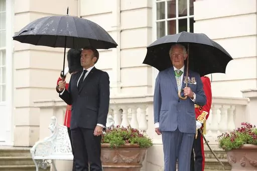 Britain's Prince Charles welcomes French president Emmanuel Macron, left, to Clarence House in London, Thursday June 18, 2020. French President Emmanuel Macron’s office on Friday, March 24, 2023, said a state visit by Britain’s King Charles III has been postponed amid mass strikes and protests in France. The king had been scheduled to arrive in France on Sunday on his first state visit as monarch, before heading to Germany on Wednesday. (Jonathan Brady/Pool via AP, File)