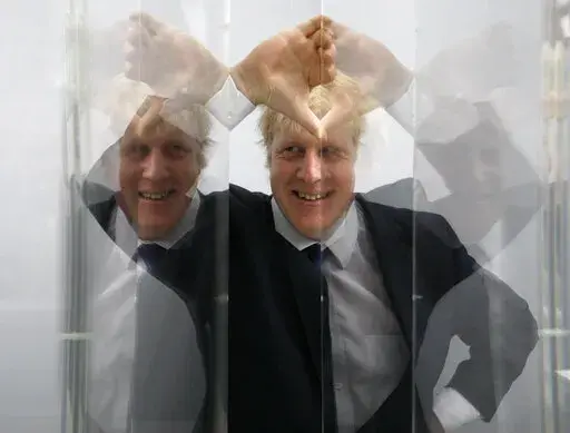Boris Johnson, then Mayor of London in seen looking through perspex as models of the next two commissions that will appear on the fourth plinth in Trafalgar Square in London, Friday, Jan. 14, 2011. For Boris Johnson, facts have always been flexible. The British prime minister's career is littered with doctored quotes, tall tales, exaggerations and mistruths. When called out, he has generally offered an apologetic shrug or a guilty grin, and moved on. At least until now. Revelations that the prim
