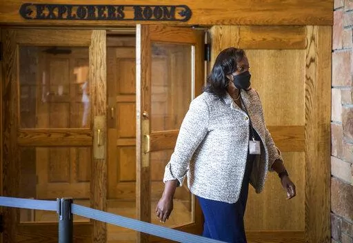 Lisa D. Cook, a member of the Board of Governors of the Federal Reserve System, takes a break at the central bank's annual symposium on Friday, August 26, 2022, at Grand Teton National Park in Moran, Wyo. (AP Photo/Amber Baesler)
