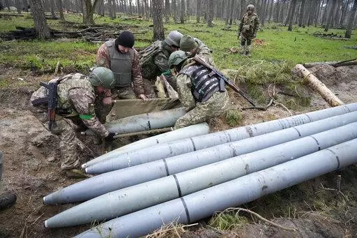 Ukrainian soldiers collect multiple Russian 'Uragan' missiles after recent fights in the village of Berezivka, Ukraine, April 21, 2022. A majority of U.S. adults say misinformation around Russia’s invasion of Ukraine is a major problem, and they largely fault the Russian government for spreading those falsehoods. A new poll from The Associated Press-NORC Center for Public Affairs Research shows 61% of Americans say the spread of misinformation about the war is a major problem, with only 7% say