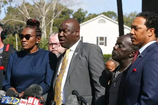 Attorney Benjamin Crump speaks to the media Tuesday, Feb. 22, 2022 outside the federal courthouse in Brunswick, Ga. The three men convicted of murder in Ahmaud Arbery’s fatal shooting have been found guilty of federal hate crimes. A jury delivered its verdict Tuesday after several hours of deliberations. (AP Photo/Lewis Levine)