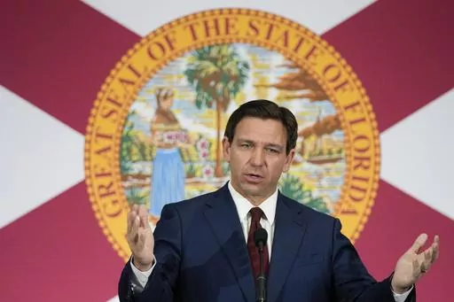 Florida Gov. Ron DeSantis speaks during a news conference to sign several bills related to public education and increases in teacher pay, in Miami, Tuesday, May 9, 2023. DeSantis and former President Donald Trump will share the spotlight in Iowa on Saturday, May 13, providing a chance to sway influential conservative activists and contrast their campaign styles in Republicans' leadoff voting state. (AP Photo/Rebecca Blackwell)
