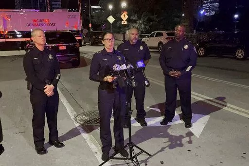 Assistant Police Chief Nicole J. Waldner holds a news conference early Saturday, Sept. 3, 2022 following a fatal shooting downtown Milwaukee.  A man was killed by Milwaukee officers after he led them on a chase into a busy downtown bar district, then got out of his vehicle and opened fire on them, police said.  One bystander was hit by gunfire in the Friday night shootout, police said. (Drake Bentley/Milwaukee Journal-Sentinel via AP)