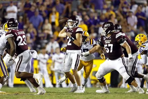 Mississippi State quarterback Will Rogers (2) looks to pass in front of LSU defensive end BJ Ojulari (18) during the second half of an NCAA college football game in Baton Rouge, La., Saturday, Sept. 17, 2022. LSU won 31-16. (AP Photo/Tyler Kaufman)