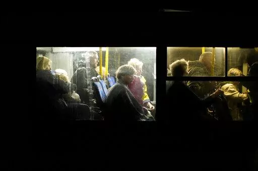 People who fled from Mariupol, a few of them from the Azovstal steel plant, arrive by bus to a reception center for displaced people in Zaporizhzhia, Ukraine, Sunday, May 8, 2022. Thousands of Ukrainian continue to leave Russian occupied areas. (AP Photo/Francisco Seco)