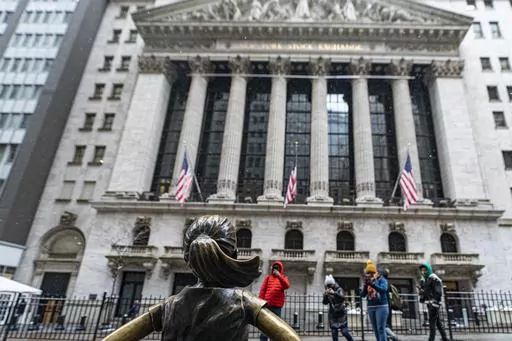 The Fearless Girl statue stands outside of the New York Stock Exchange is shown on Friday, Jan. 19, 2024, in New York. Wall Street is rising Friday and may break past its all-time high set two years ago, before the highest inflation and interest rates in decades sent financial markets tanking worldwide. (AP Photo/Peter K. Afriyie)
