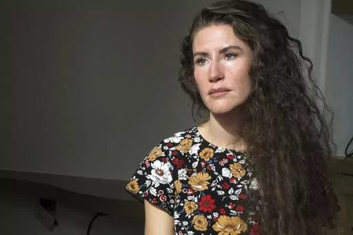 Chelsea Goodrich poses for a portrait at a friend's house in Ketchum, Idaho, on Tuesday, Sept. 19, 2023. Goodrich's father, a popular Idaho dentist and former bishop in The Church of Jesus Christ of Latter-day Saints, widely known as the Mormon church, was excommunicated after sharing details about his relationship with her when she was a child during a religious confession. Recordings obtained by The Associated Press show that instead of helping prosecutors, the church used a legal playbook tha