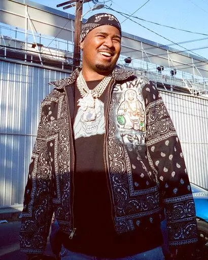 In this March 2021 photo provided by Scott Jawson, West Coast rapper Drakeo the Ruler is seen outside a recording studio in Los Angeles. Drakeo the Ruler, whose real name was Darrell Caldwell, was fatally stabbed in an altercation at a Los Angeles music festival Saturday, Dec. 18, 2021. His publicist confirmed the death to the New York Times. The 28-year-old was assaulted at the Once Upon a Time in LA concert Saturday night. (Wyatt Winfrey/Courtesy of Scott Jawson via AP)