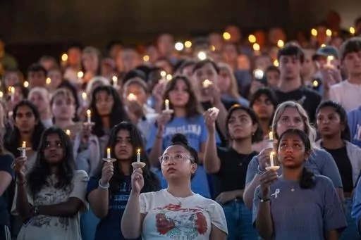 University of North Carolina-Chapel Hill students, faculty and family hold a candlelight vigil, Aug 30, 2023, in Chapel Hill, N.C., in honor of professor Zijie Yan, who was shot and killed on campus earlier that week. Two shooting 30 years apart at the University of North Carolina show how much has changed. Some alumni who remember a deadly shooting in 1995 now have children enrolled at their alma mater in Chapel Hill, where an associate professor was shot to death Aug. 28. In some ways, the era