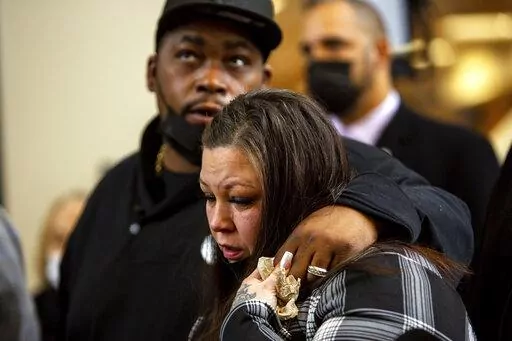 Daunte Wright's parents, Aubrey Wright and Katie Wright, who also sometimes uses the name Katie Bryant, react after former Brooklyn Center Police Officer Kim Potter was sentenced to two years in prison, Friday, Feb. 18, 2022 in Minneapolis. Potter was convicted in December of both first-degree and second-degree manslaughter in the April 11 killing of Wright, a 20-year-old Black motorist. (AP Photo/Nicole Neri )