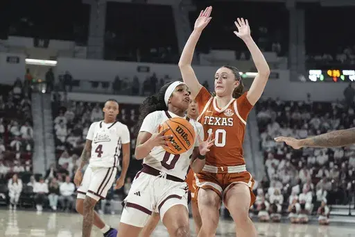 Mississippi State guard Denim DeShields (0) is guarded by Texas guard Shay Holle (10) during the second half of an NCAA college basketball game, Thursday, Feb. 27, 2025, in Starkville, Miss. (AP Photo/Rogelio V. Solis)