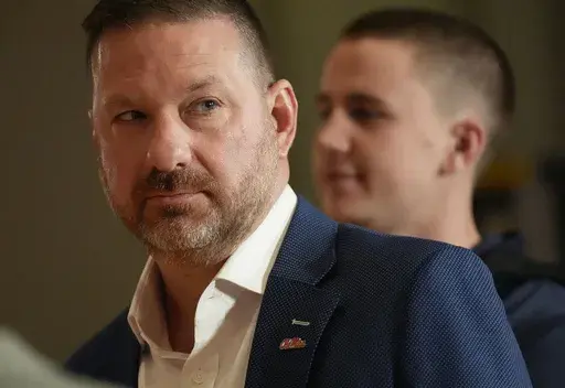 Ole Miss head coach Chris Beard moves between interviews during the Southeastern Conference NCAA college basketball Media Day in Birmingham, Ala., Tuesday, Oct. 15, 2024. (AP Photo/Gary Cosby Jr., Tuscaloosa News)