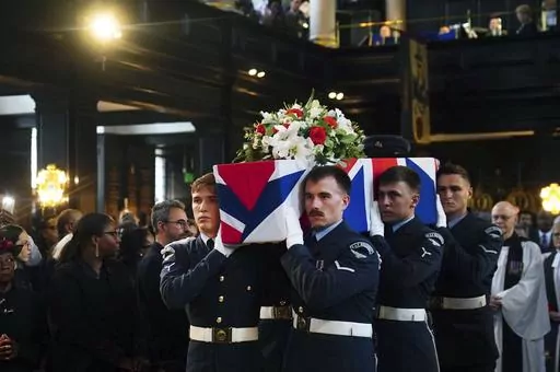 People gather for the funeral of former RAF Sergeant Peter Brown originally from Jamaica, at St Clement Danes Church, in London, Thursday May 25, 2023. Flight Sgt. Peter Brown who flew bombing missions in World War II after volunteering for the Royal Air Force died in December, aged 96. Volunteers tried to track down family and people who knew him. Word of that search drew interest from others who didn't want him to be forgotten for the service he offered in Britain's darkest hour. (Victoria Jon