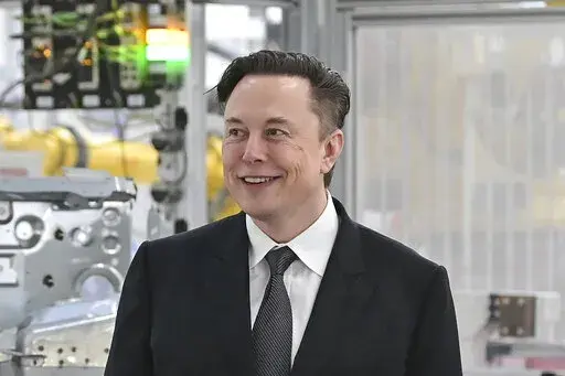 Tesla CEO Elon Musk attends the opening of the Tesla factory Berlin Brandenburg in Gruenheide, Germany on March 22, 2022. Musk says his deal to buy Twitter can’t ‘move forward’ unless the company shows public proof that less than 5% of the accounts on the platform are fake or spam. Musk made the comment in a reply to another user on Twitter early Tuesday, May 17, 2022. (Patrick Pleul/Pool Photo via AP, File)
