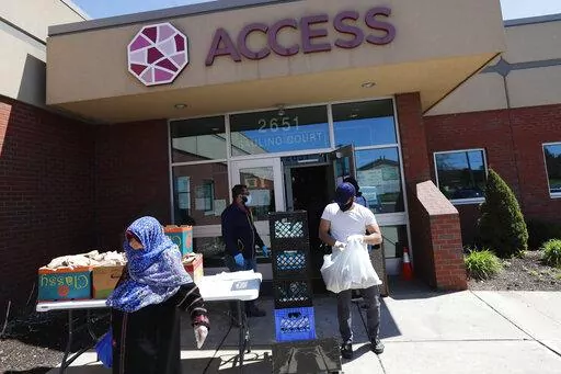Workers at ACCESS, the Arab Community Center for Economic and Social Services, help with meals for the Arab community in Dearborn, Mich., on May 1, 2020.  The federal government is taking preliminary steps toward revising racial and ethnic classifications on census and survey forms for the first time in a quarter century following calls to create a new category for people of Middle Eastern and North African descent and a desire to make categories less confusing for Hispanic participants. (AP Pho