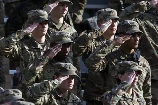West Point cadets salute during the National Anthem prior to the NCAA college football game between the Army Black Knights and Massachusetts at Michie Stadium, Saturday, Nov. 20, 2021, in West Point, N.Y. (AP Photo/Eduardo Munoz Alvarez, File)