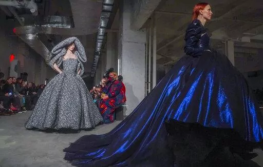 Fashion from Christian Siriano fall/winter 2022 collection is modeled during Fashion Week, Saturday Feb. 12, 2022, in New York. (AP Photo/Bebeto Matthews)