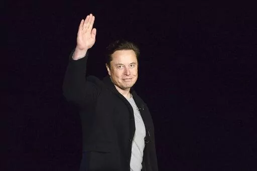 SpaceX's Elon Musk waves while providing an update on Starship, on Feb. 10, 2022, near Brownsville, Texas. Musk's Twitter has dissolved its Trust and Safety Council, the advisory group of around 100 independent civil, human rights and other organizations that the company formed in 2016 to address hate speech, child exploitation, suicide, self-harm and other problems on the platform. The council had been scheduled to meet with Twitter representatives Monday night, Dec. 12. But Twitter informed th