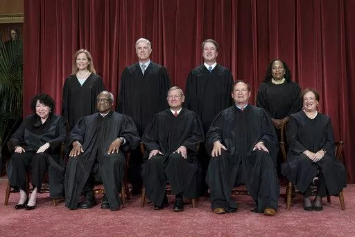 Members of the Supreme Court sit for a new group portrait following the addition of Associate Justice Ketanji Brown Jackson, at the Supreme Court building in Washington, Friday, Oct. 7, 2022. Bottom row, from left, Associate Justice Sonia Sotomayor, Associate Justice Clarence Thomas, Chief Justice of the United States John Roberts, Associate Justice Samuel Alito, and Associate Justice Elena Kagan. Top row, from left, Associate Justice Amy Coney Barrett, Associate Justice Neil Gorsuch, Associate 