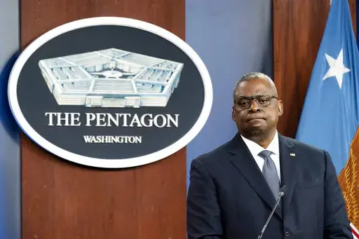 FILE - Secretary of Defense Lloyd Austin pauses while speaking during a media briefing at the Pentagon, Wednesday, Nov. 17, 2021, in Washington. In February, with the images of the violent insurrection in Washington still fresh in the minds of Americans, the newly confirmed defense secretary took the unprecedented step of signing a memo directing commanding officers across the military to institute a one-day stand-down to address extremism within the nation’s armed forces. (AP Photo/Alex Brand