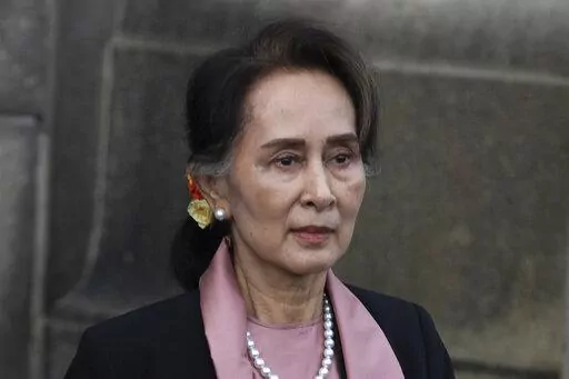 Myanmar's leader Aung San Suu Kyi leaves the International Court of Justice after the first day of three days of hearings in The Hague, Netherlands, on Dec. 10, 2019. A court in Myanmar on Monday, Jan. 10, 2022, sentenced the country's ousted leader, Aung San Suu Kyi to 4 more years’ imprisonment after finding her guilty of illegally importing and possessing walkie-talkies and violating coronavirus restrictions,a legal official acquainted with the cases said. (AP Photo/Peter Dejong, File)