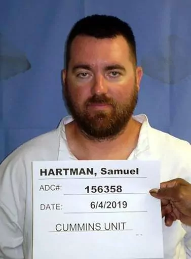This booking photo provided by the Arkansas Department of Correction shows Samuel Hartman, who escaped from an east Arkansas prison on Friday, Aug. 12, 2022. The U.S. Marshals Service announced that Hartman was arrested Tuesday, Aug. 29, 2023, along with his wife, his mother and his mother's boyfriend at a hotel in Lewisburg, W.Va. (Arkansas Department of Correction via AP, File)