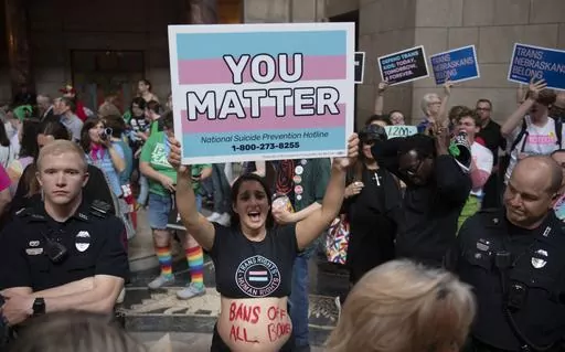 Khalisha Casey of Lincoln protests LB574, which limits gender-affirming care for trans youth, Friday, May 19, 2023, in Lincoln, Neb. (Justin Wan/Lincoln Journal Star via AP)