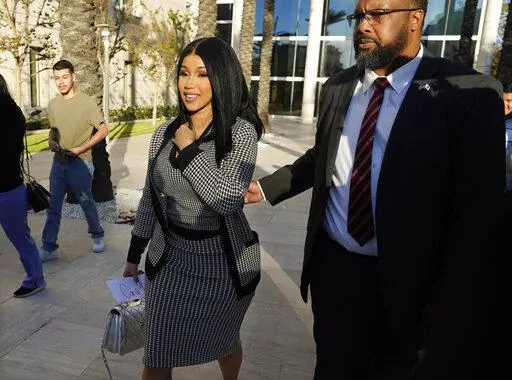 Cardi B exits federal court as proceedings continue in a $5 million copyright infringement lawsuit against her in federal court, Wednesday, Oct. 19, 2022, in Santa Ana, Calif. Kevin Michael Brophy is suing the Grammy-winning musician for allegedly misusing his likeness for her sexually suggestive mixtape cover art in 2016. (AP Photo/Chris Pizzello)