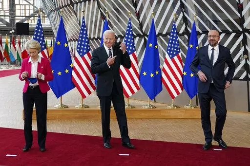 European Commission President Ursula von der Leyen, from left, President Joe Biden and European Council President Charles Michel remove their masks before participating in the United States-European Union Summit at the European Council in Brussels, Tuesday, June 15, 2021. Even before Air Force One touches down in Brussels to bring President Biden to three summits in one Thursday, Western allies have already found what they are looking for, that all too rare sense of unity. (AP Photo/Patrick Sema