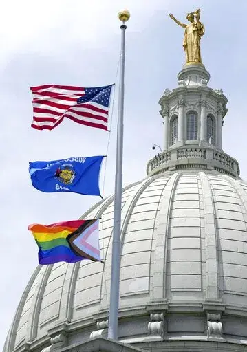 In this Wednesday, June 1, 2022, photo, a Rainbow Pride flag is raised at the Capitol in Madison, Wis. A Wisconsin school board has voted in favor of a policy that prohibits teachers and staff from displaying gay pride flags and other items that district officials consider political in nature. (Mark Hoffman/Milwaukee Journal-Sentinel via AP, File)
