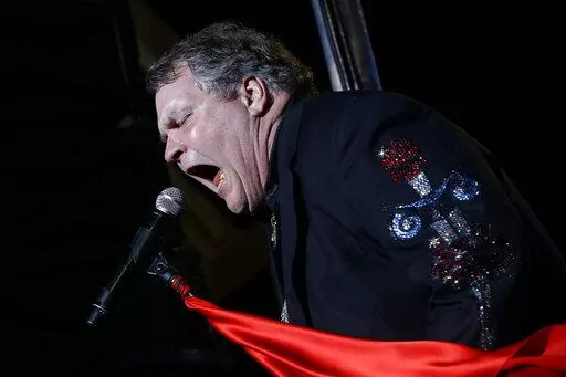 Singer Meat Loaf performs in support of Republican presidential candidate and former Massachusetts Gov. Mitt Romney at the football stadium at Defiance High School in Defiance, Ohio, Thursday, Oct. 25, 2012. Meat Loaf, whose "Bat Out Of Hell" album is one of the all time bestsellers, has died, family said on Facebook, Friday, Jan. 21, 2022. (AP Photo/Charles Dharapak, File)
