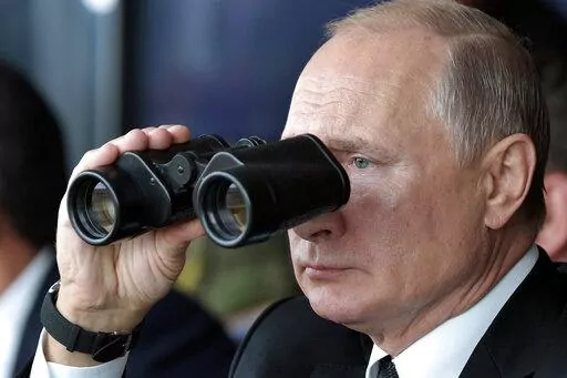 Russian President Vladimir Putin holds binoculars while watching the military exercises Center-2019 at Donguz shooting range near Orenburg, Russia, in Sept. 20, 2019. Russian President Vladimir Putin has warned that he wouldn't hesitate to use nuclear weapons to ward off Ukraine's attempt to reclaim control of its occupied regions that Moscow is about to absorb. (Alexei Nikolsky, Sputnik, Kremlin Pool Photo via AP, File)