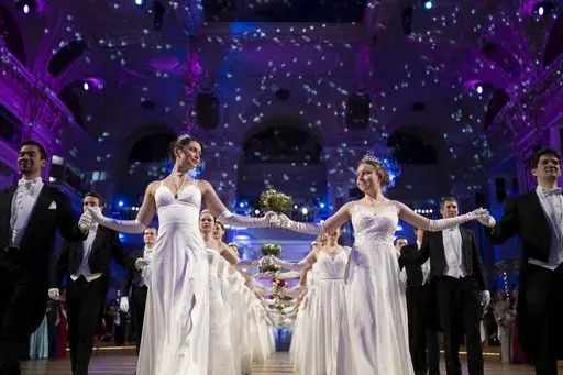 Young people participate in the opening ceremony of the Lawyers' Ball in Vienna, Austria, Saturday, March 1, 2025. (AP Photo/Denes Erdos)