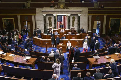 FILE - Members of the House of Representatives gather in the chamber to vote on creation of a select committee to investigate the Jan. 6 Capitol insurrection, at the Capitol in Washington, on June 30, 2021. (AP Photo/J. Scott Applewhite, File)
