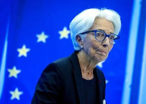 Christine Lagarde, President of the European Central Bank smiles during a press conference following a meeting of the governing council in Frankfurt, Germany, Thursday, July 21, 2022. (AP Photo/Michael Probst)