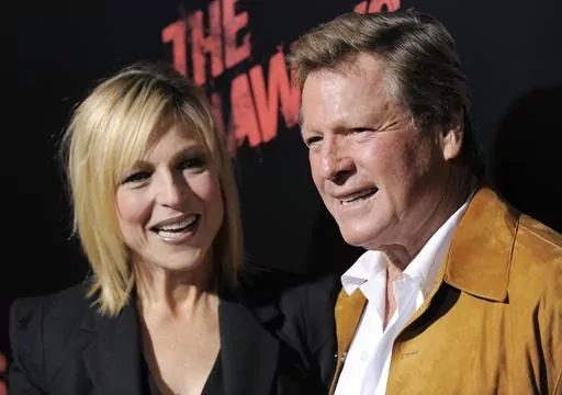 Tatum O'Neal, left, a cast member in "The Runaways," and her father, actor Ryan O'Neal, pose together at the premiere of the film in Los Angeles, Thursday, March 11, 2010. Ryan O’Neal, who was nominated for an Oscar for the tear-jerker “Love Story” and played opposite his precocious daughter Tatum in “Paper Moon,” has died. O’Neal's son Patrick said on Instagram that his father died Friday, Dec. 8, 2023. (AP Photo/Chris Pizzello, File)