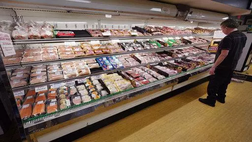 A man looks at beef in the meat department at Lambert's Rainbow Market, on  June 15, 2021 in Westwood, Mass.  The Labor Department said Thursday, Feb. 10, 2022,  that consumer prices jumped 7.5% last month compared with a year earlier, the steepest year-over-year increase since February 1982. The acceleration of prices ranged across the economy, from food and furniture to apartment rents, airline fares and electricity.  (AP Photo/Charles Krupa)