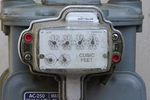 A gas meters keep tabs on usage at this Jackson, Miss., residence, Feb. 22, 2022. With energy prices rising and summer heat looming, it’s a good time to make sure your home is running as efficiently as possible. (AP Photo/Rogelio V. Solis, File)